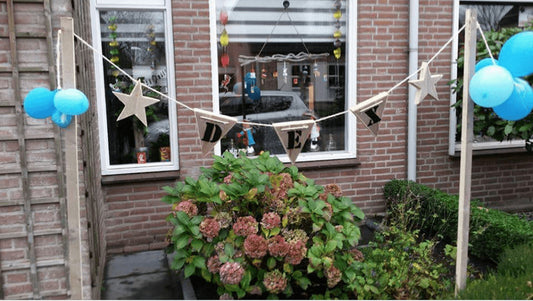 Steigerhouten geboorte slinger